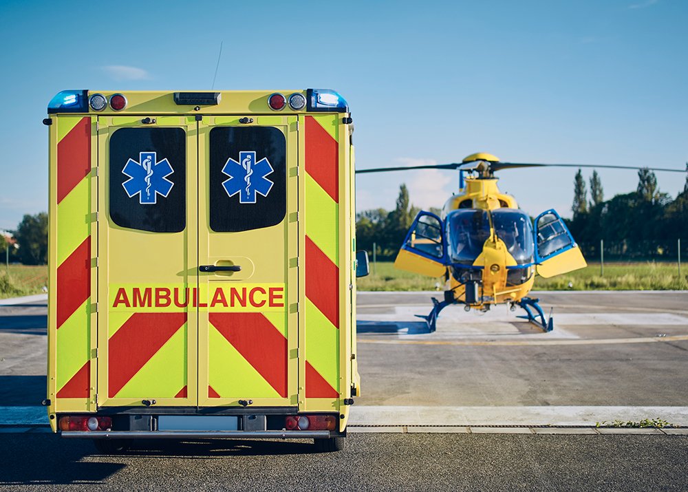 An ambulance vehicle and helicopter