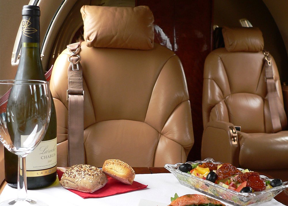 Luxury dining with champagne and a meal.